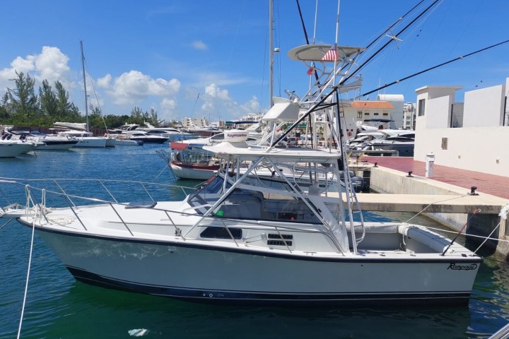 a boat is docked next to a body of water